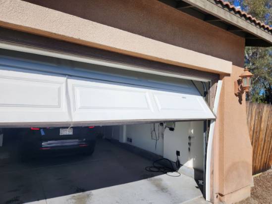 Damaged-Garage-Door-with-Cable-off