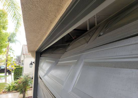 Highly-Dented-Garage-Door-Somewhat-Repairable